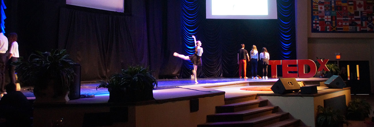 Two students dancing on a stage