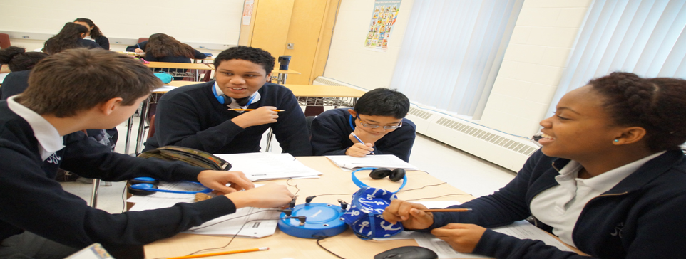 male and female students talking in a classroom